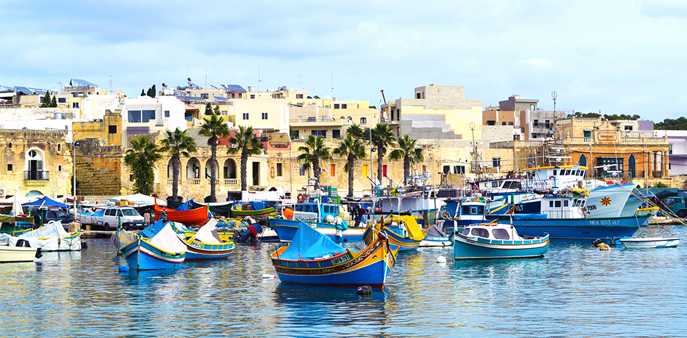 Marsasloxx Harbour with colourful boats in Malta