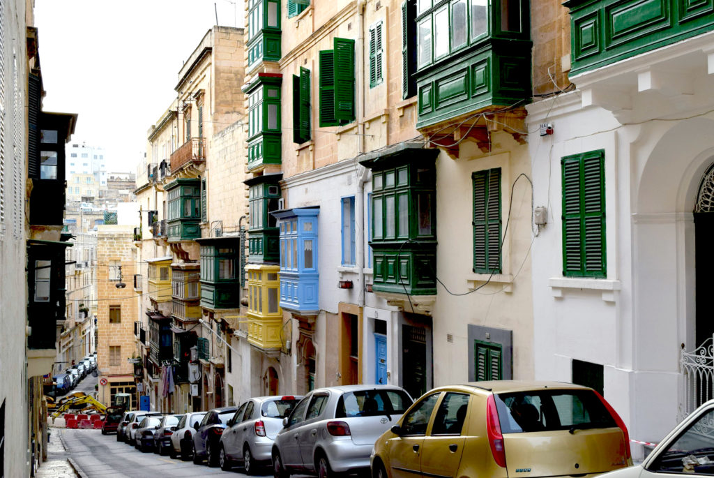 Typical Street with cars and bay windows in Valletta, Malta